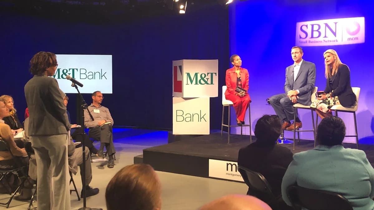 Speakers at a community business event